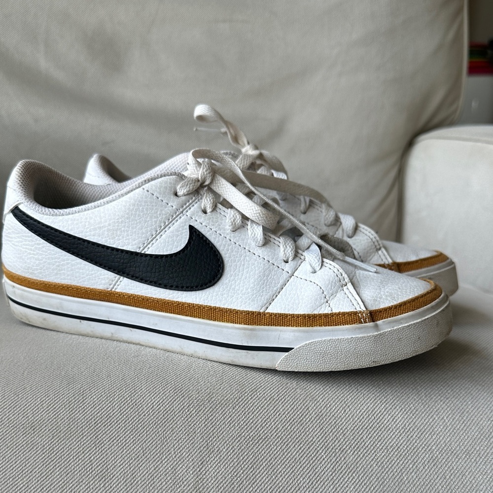 Nike Women’s White and Black Sneakers with Gold Trim
